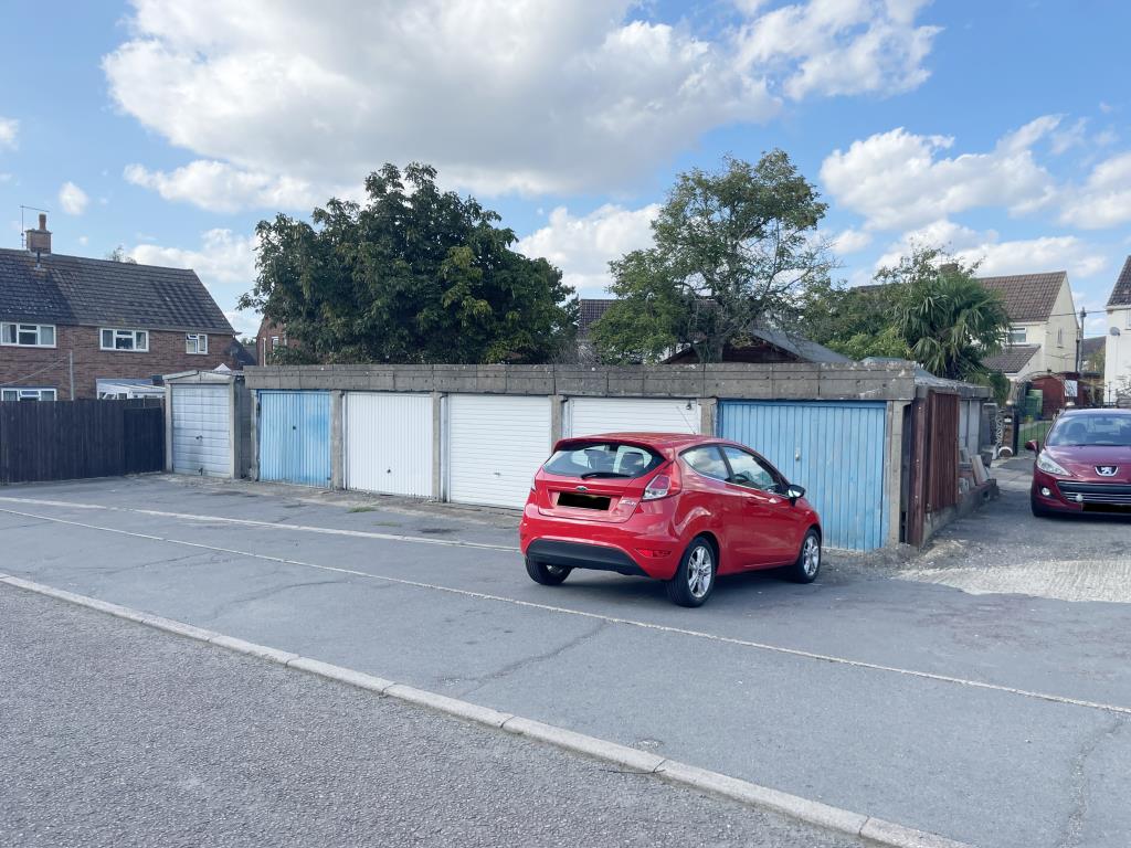 Lot: 40 - NINE GARAGES AND LAND - Five garages in village